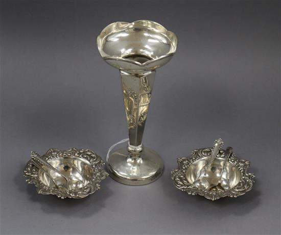 A silver spill vase, a pair of late Victorian silver bonbon dishes and four silver condiment spoons.